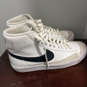 Nike White High-Top Sneakers with Black Swoosh